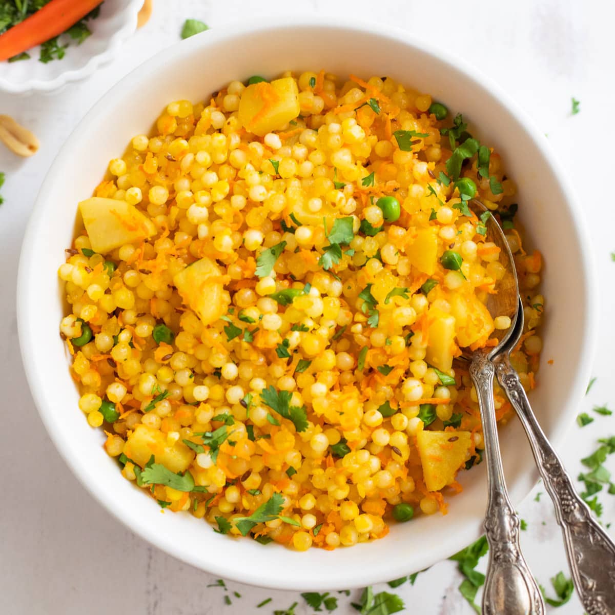 Sabudana Khichdi in a bowl, garnished with cilantro leaves