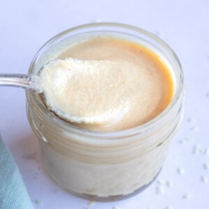 Smooth Tahini paste in a small glass jar
