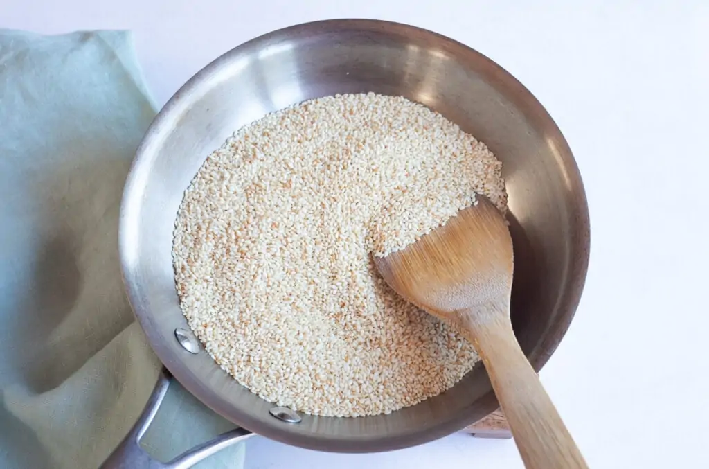 Roasting sesame seeds in a pan