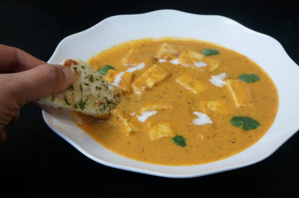 Chunks of paneer or cottage cheese cooked in a mildly spiced tomato gravy. Delicious and very easy to make Paneer Butter Masala in the instant pot. Great to dip naan. 