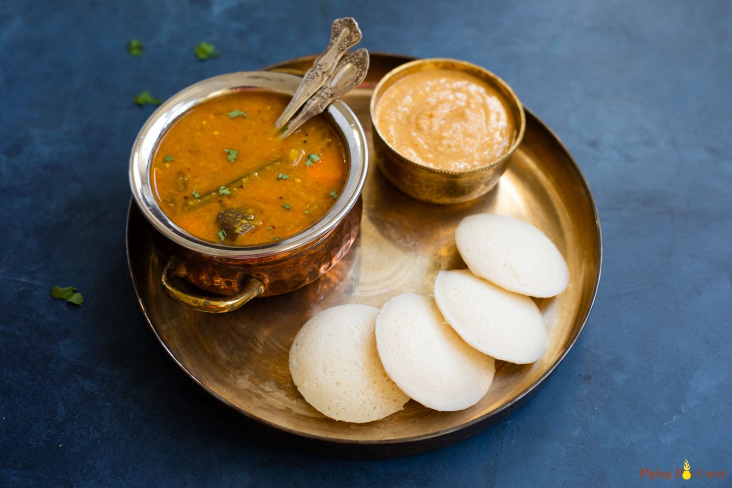 Idli served with sambar and chutney