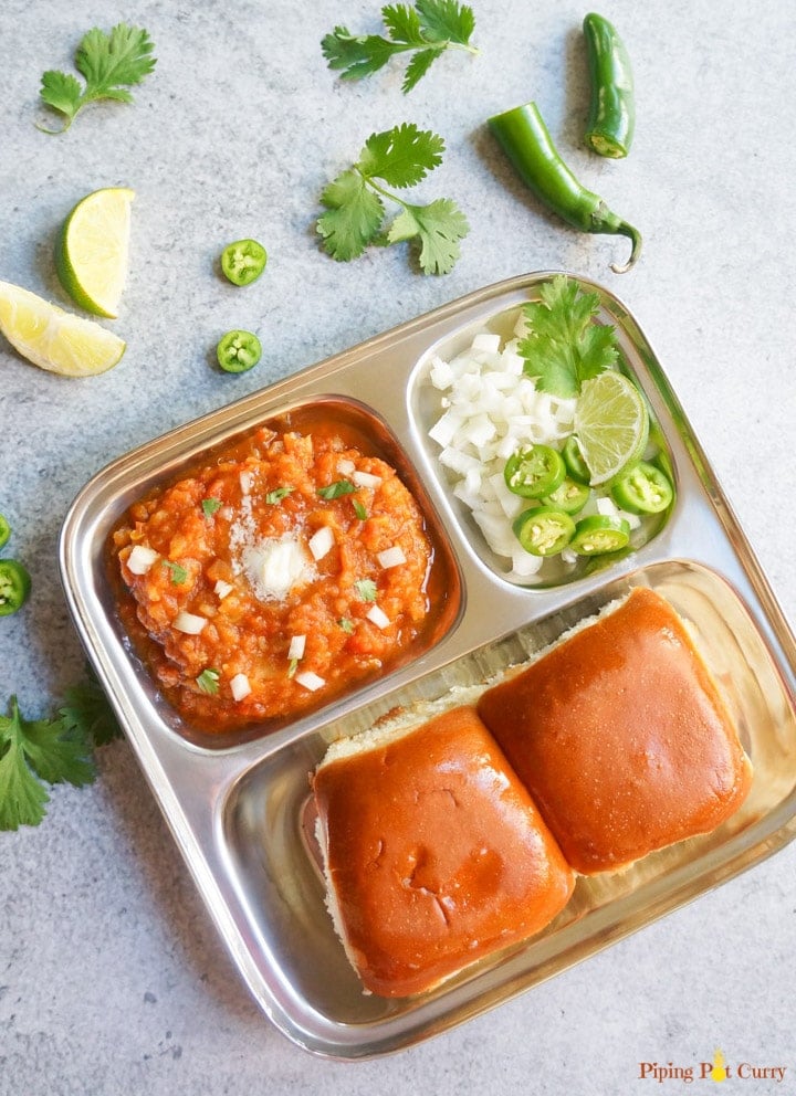 Pav Bhaji is a popular Indian street food, made with potatoes and vegetables cooked in a tomato base & enjoyed with dinner rolls. Try this one-pot recipe made in 30 minutes & you will not make it any other way again!