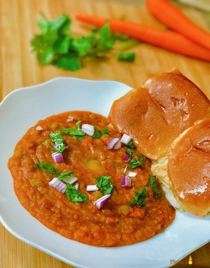 Pav Bhaji is a popular Indian street food, made with potatoes and vegetables cooked in a tomato base & enjoyed with dinner rolls. Try this one-pot recipe made in 30 minutes & you will not make it any other way again!