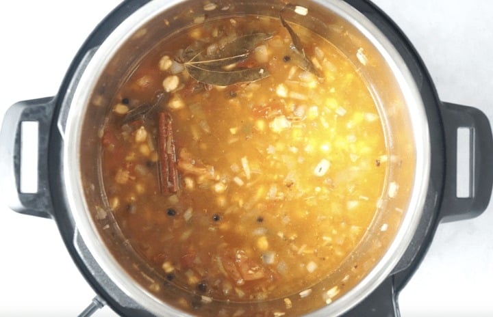 Chole Recipe Step 4 Chole Recipe Step 4 - Add chickpeas and water in pressure cooker