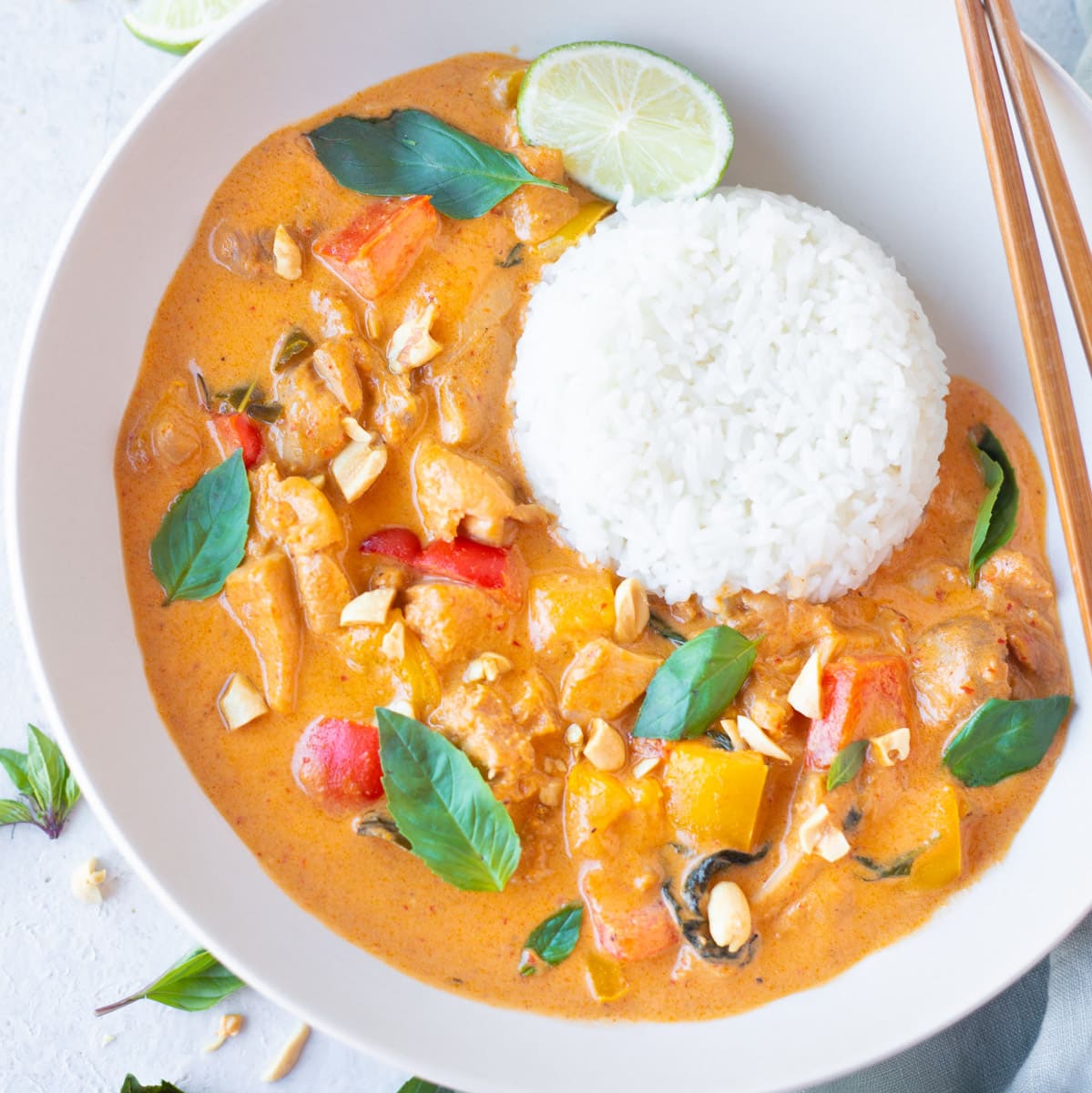 Thai Panang Curry with chicken and coconut milk served in a bowl with jasmine rice