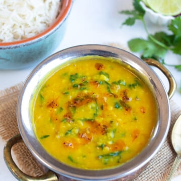 Dal Palak (Lentils with spinach) in a pretty bowl with rice on the side
