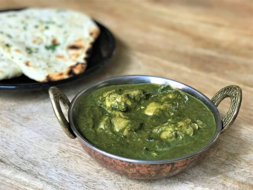 Indian style chicken saag in a small bowl. 