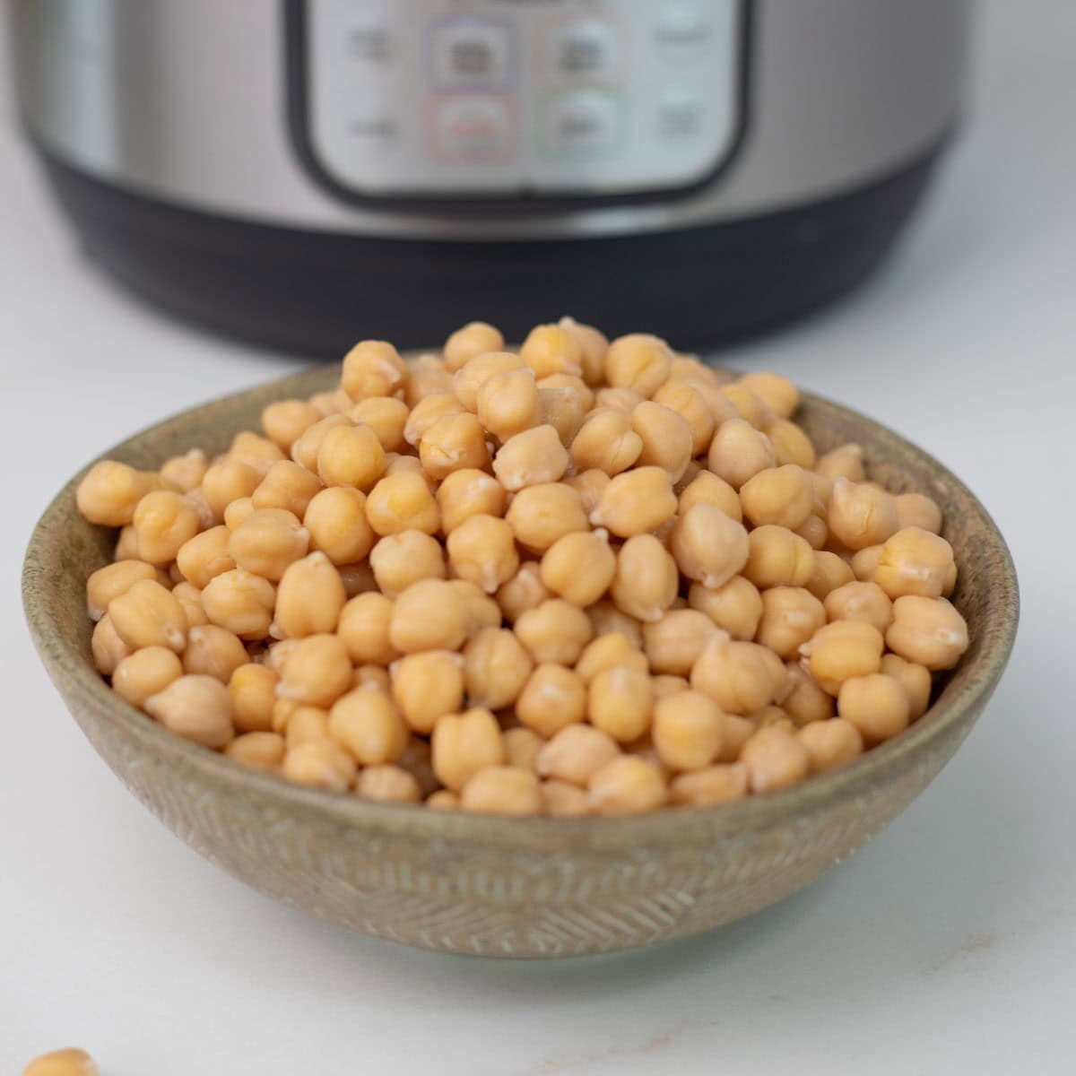 Tender chickpeas cooked in the instant pot in a bowl.
