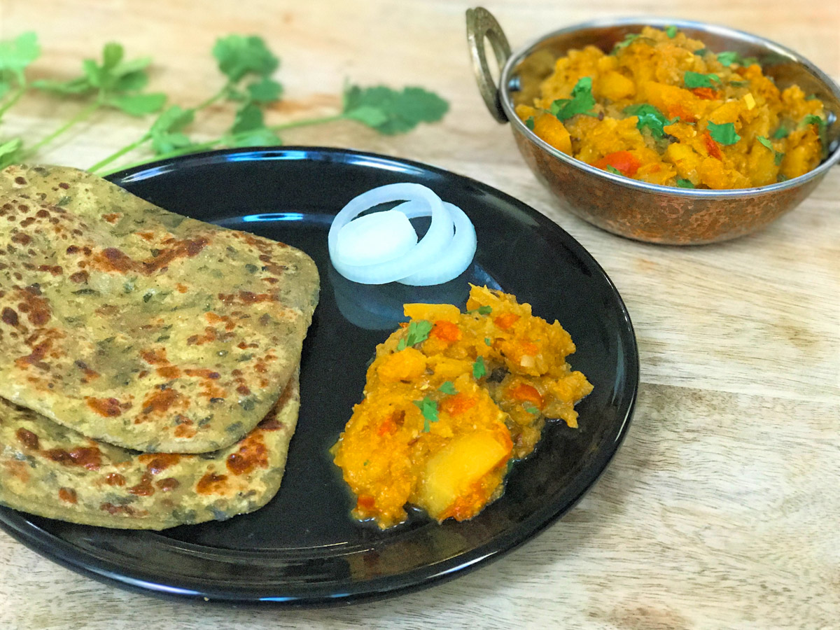Pumpkin curry cooked in the Instant Pot, served with paratha 