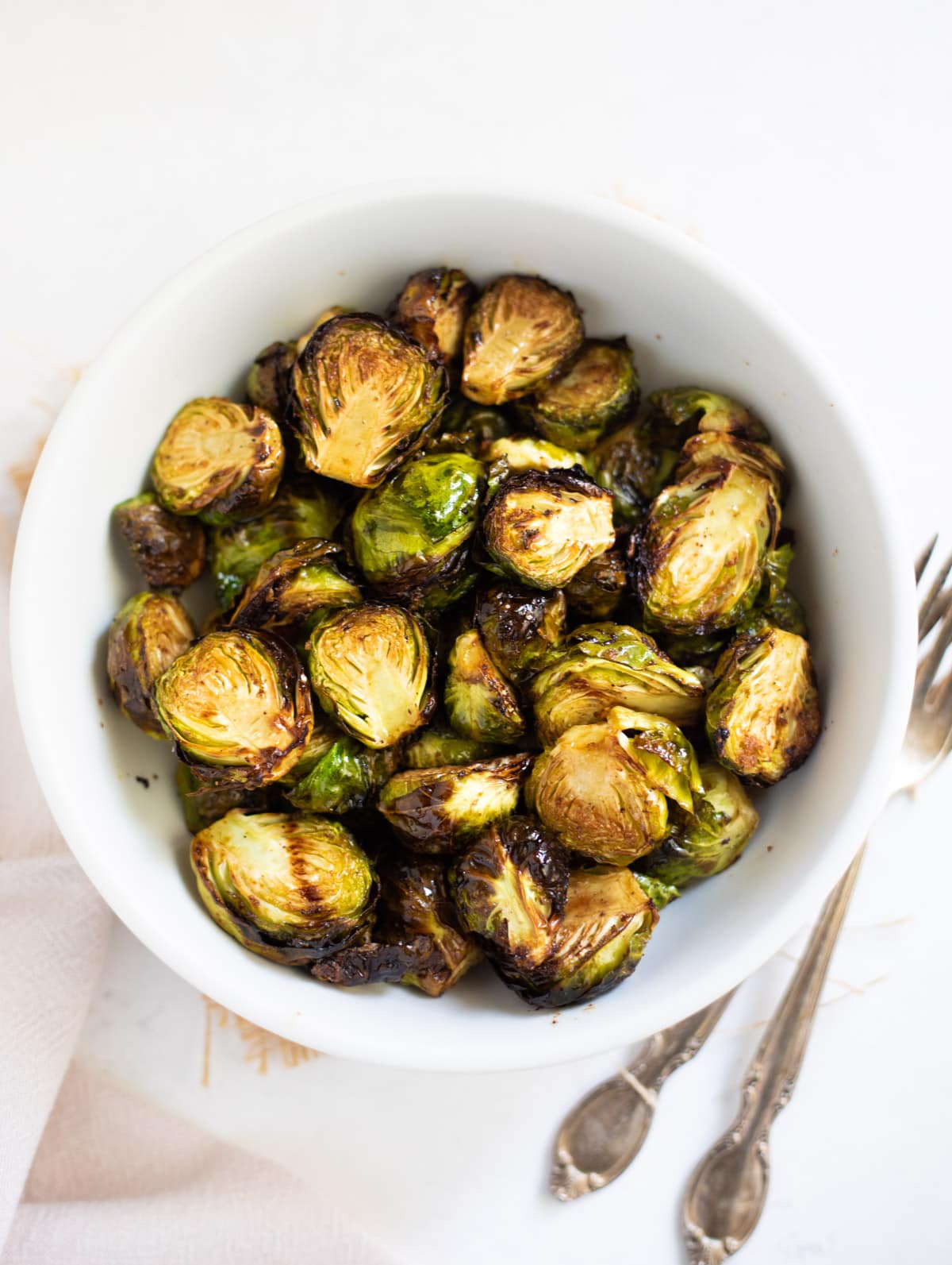 Roasted Air Fryer Brussels sprouts in a white bowl