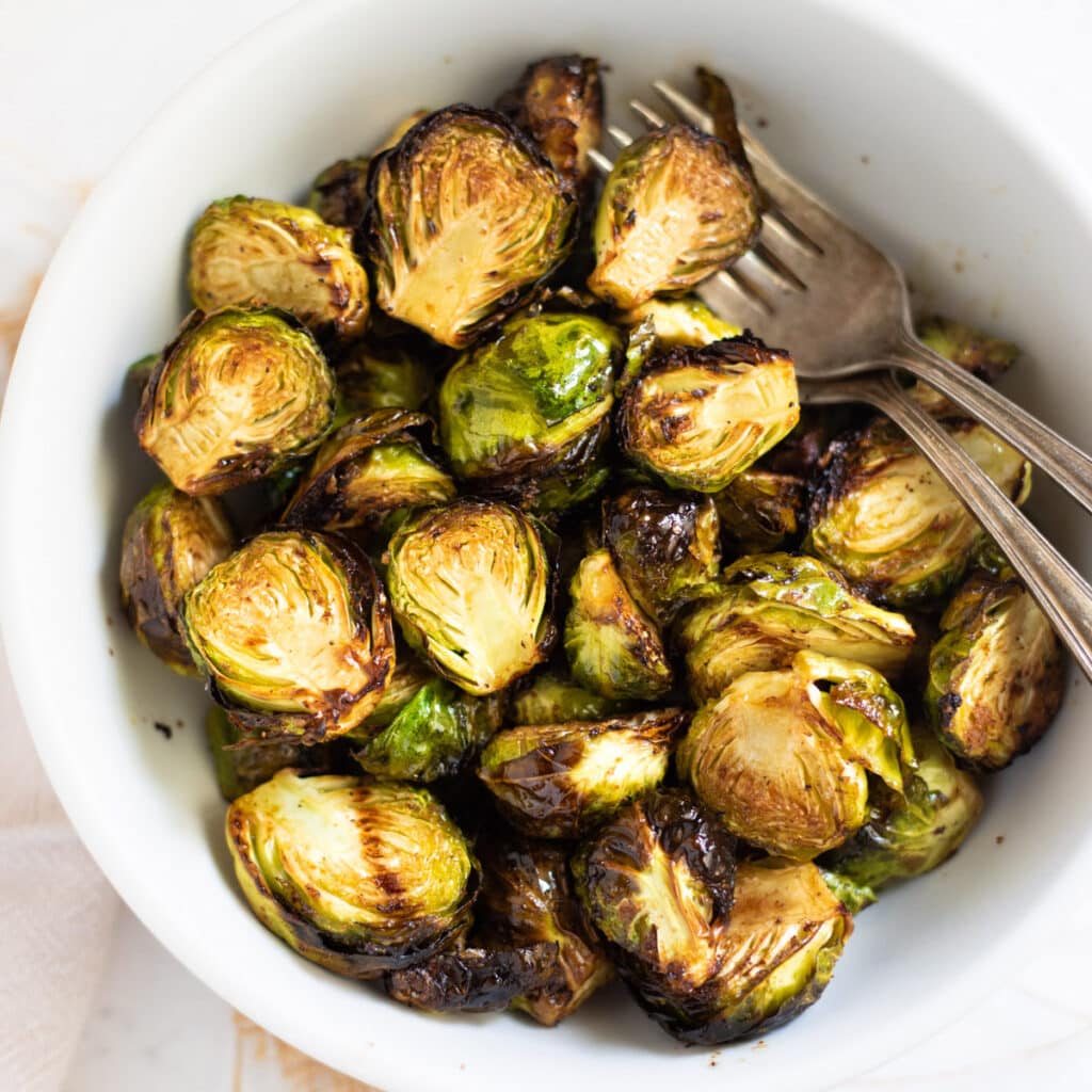 Roasted Air Fryer Brussels sprouts in a white bowl