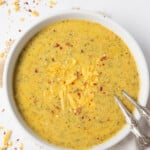 Broccoli Cheddar Soup served in a bowl with chili flakes on top