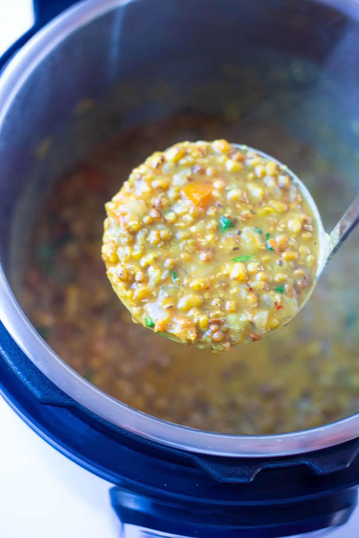 Green Moong Dal in a ladle on top of the instant pot