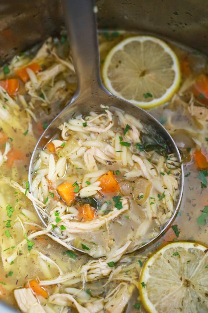 Delicious lemon chicken orzo soup in a pot