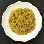 Quinoa with vegetables in a white bowl