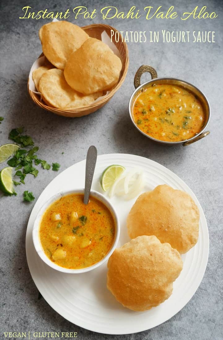 Potato Curry in Yogurt Sauce or Dahi Vale Aloo - An easy and delicious comfort food with minimal ingredients made in the Instant Pot. This curry is made with just two main ingredients, potatoes and yogurt, tempered with cumin seeds, ginger and flavorful spices. Enjoy it with puri, paratha or rice for a satisfying meal | #aloo #potato #yogurt #curry #instantpot #pressurecooker | pipingpotcurry.com