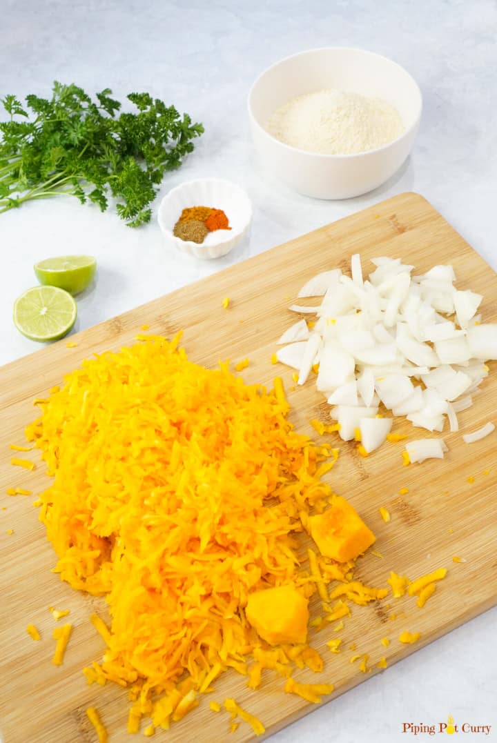 Vegan Pumpkin Fritters - Ingredients grated butternut squash, onions, chickpea flour, spices, lemon, parsley
