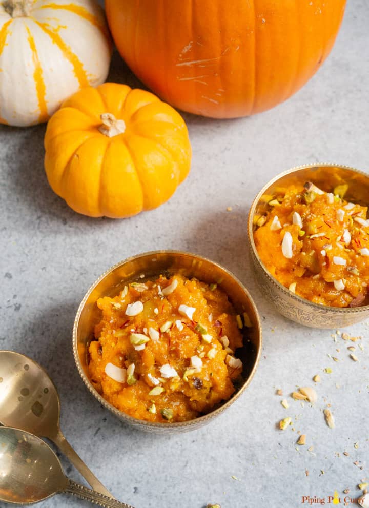 Coconut Pumpkin Halwa served in 2 bowls topped with nuts