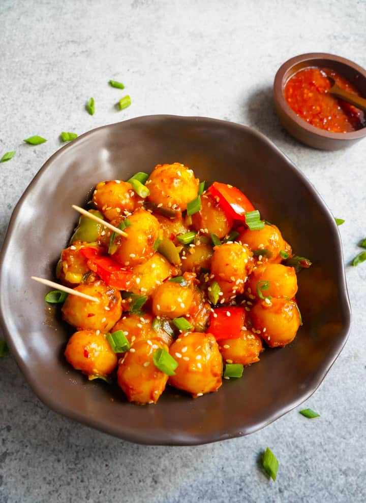 Garlic Chili potatoes in a bowl and chili sauce on the side