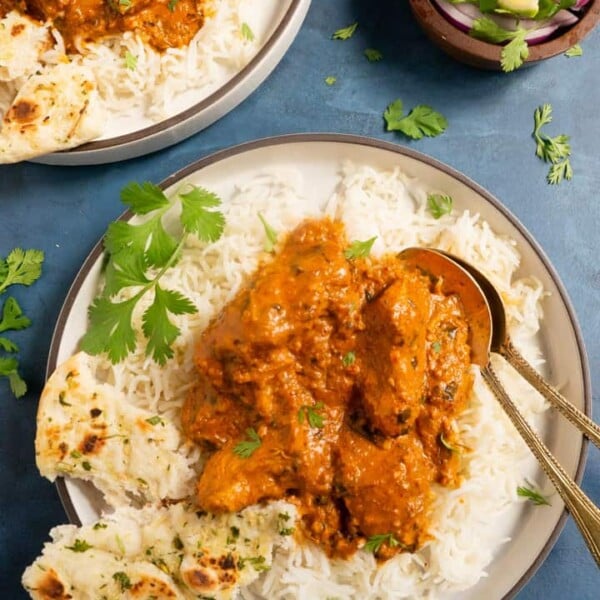Instant Pot Chicken Tikka Masala served over rice along with naan on the side