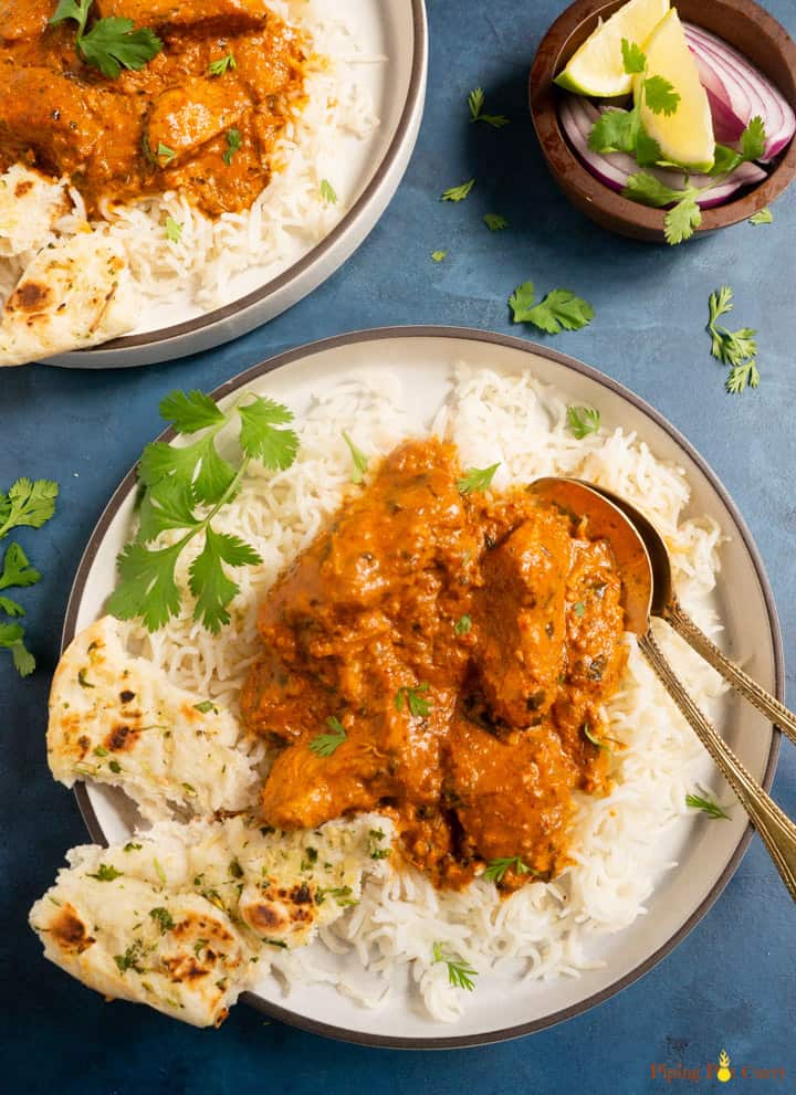 Instant Pot Chicken Tikka Masala served over rice along with naan on the side