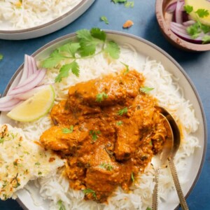 Instant Pot Chicken Tikka Masala served over rice along with naan on the side