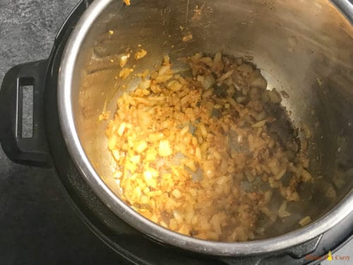 Instant Pot Chicken Tikka Masala - Step 1 saute onions & garlic