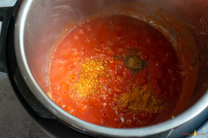 Instant Pot Salmon Tikka Masala - Step 2 - Add tomato puree and spices