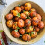 Spicy Bombay Potatoes or Masala Aloo, is baby potatoes cooked with aromatic spices. Perfect to serve as appetizer or a side dish, these delicious Bombay Potatoes take just 20 minutes to make in the Instant Pot | #babypotatoes #instantpot #potatoes #pressurecooker #bombaypotatoes #spicypotatoes | pipingpotcurry.com