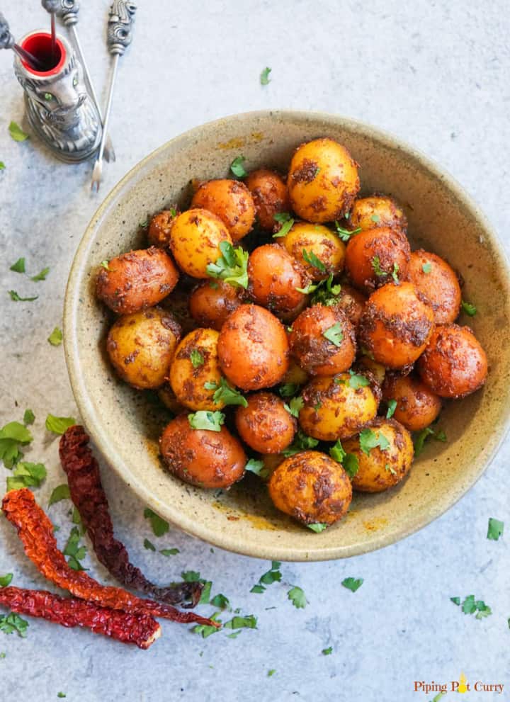 Spicy Bombay Potatoes made in Instant Pot Pressure Cooker in a bowl topped with chopped cilantro