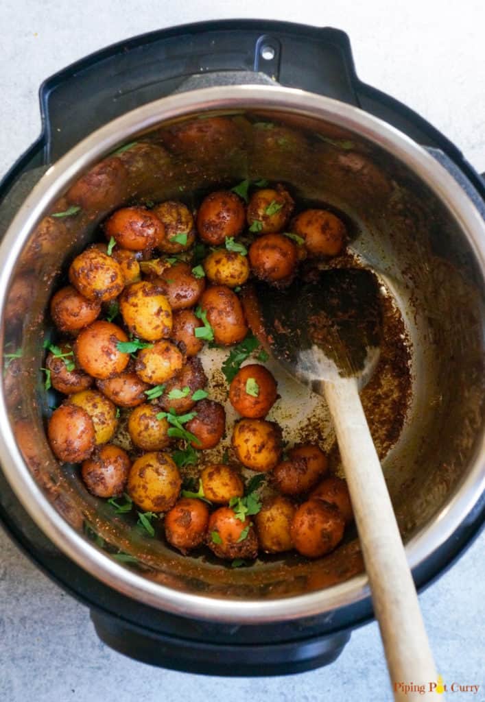 Instant Pot Spicy Baby Potatoes garnished with cilantro