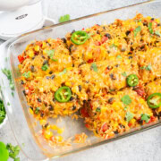 Vegetarian Mexican Casserole with rice and beans topped with cheese and jalapenos