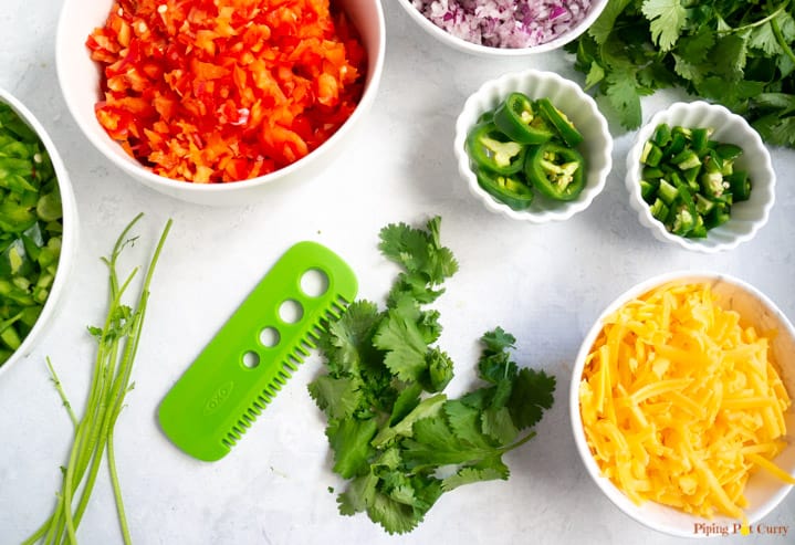 Vegetarian Mexican Casserole with Rice & Beans - Removing cilantro leaves using OXO herb stripping comb