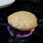 soft roti being cooked