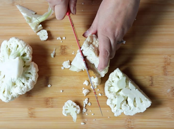 How to cut cauliflower step 3 cut core at an angle for each quarter