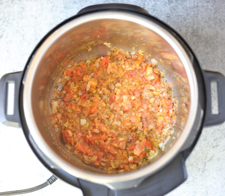 Whole Masoor Dal in Instant Pot Step 2 add tomatoes and spices