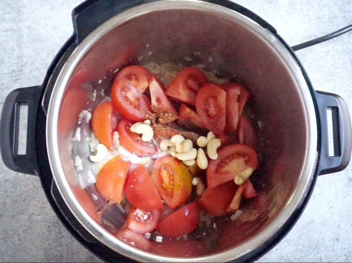 Paneer Tikka Masala in Instant Pot - 6. Add tomatoes, spices Add tomatoes, spices and cashews to make paneer tikka masala in pressure cooker