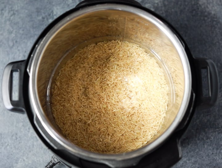 Brown Rice and water added to the instant pot steel insert