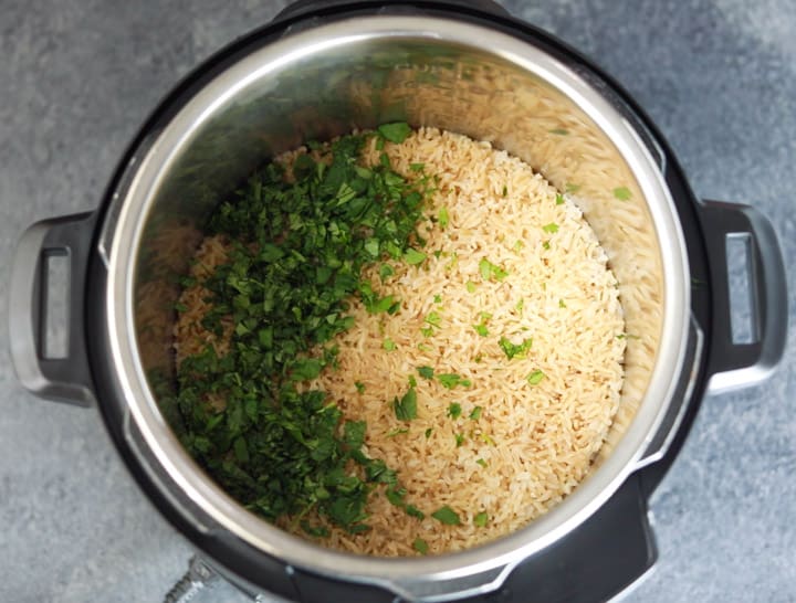 Garnish of lime juice and cilantro added to brown rice made in the instant pot