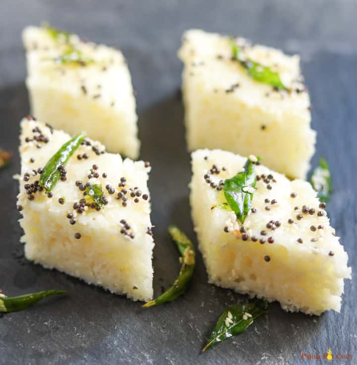 Rava Dhokla (Savory Semolina Cakes) made in the instant pot, served with tempering on a snack plate