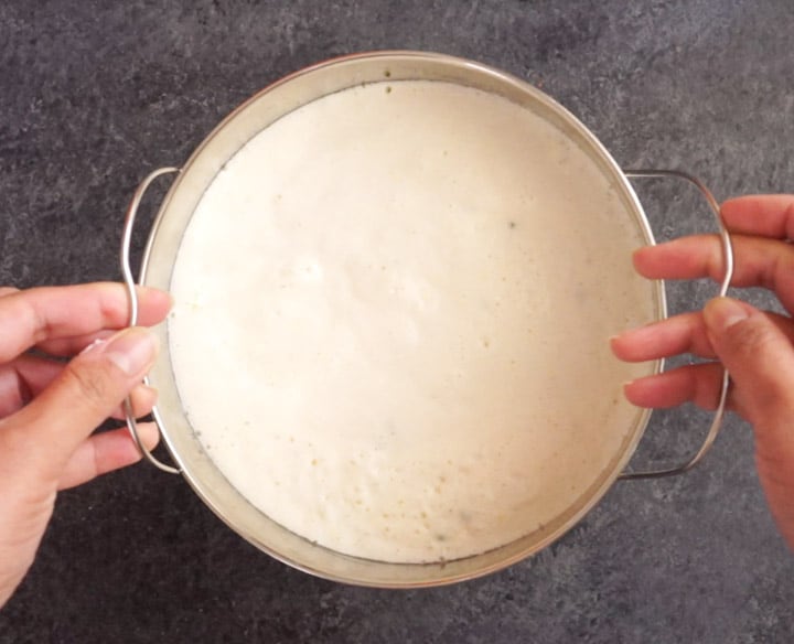 Rava Dhokla Instant Pot - Piping Pot Curry-4 Rava Dhokla batter in a steel bowl, placed on a trivet