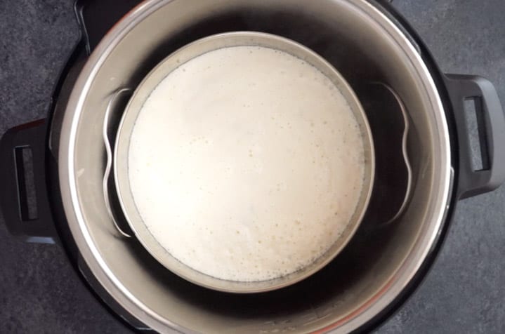 Rava Dhokla Instant Pot - Piping Pot Curry-5 Rava Dhokla batter in a steel bowl, placed in the instant pot ready to be steamed.