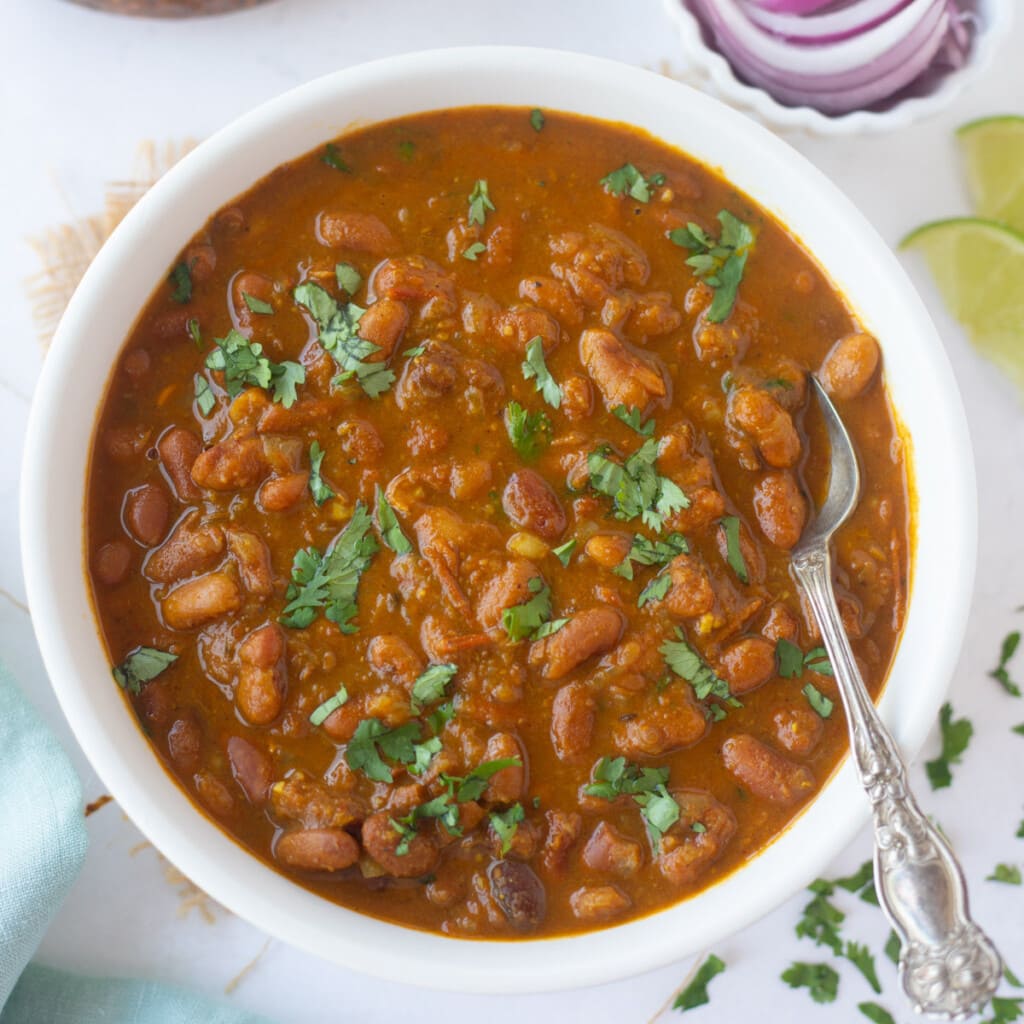 rajma served in a bowl garnished with cilantro 