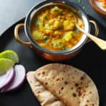 Lauki Chana Dal made in pressure cooker served along with chapati and salad