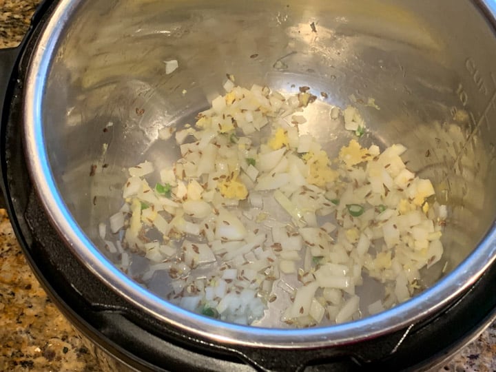 Saute onions in instant pot to make Lauki Chana Dal