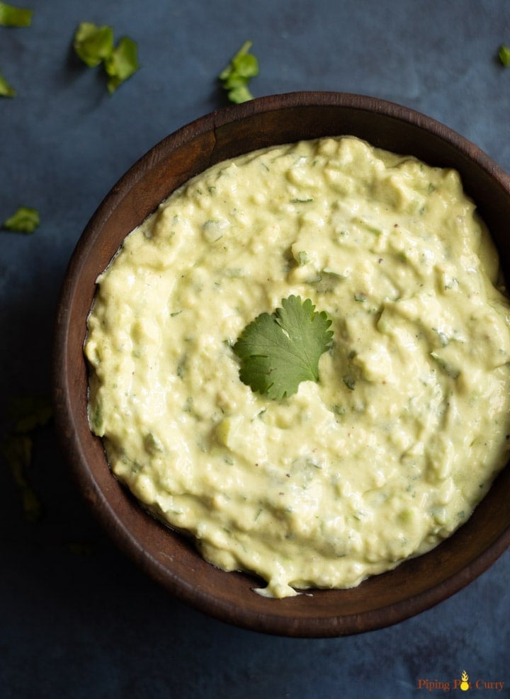 Creamy Dip in a wooden bowl garnished with cilantro
