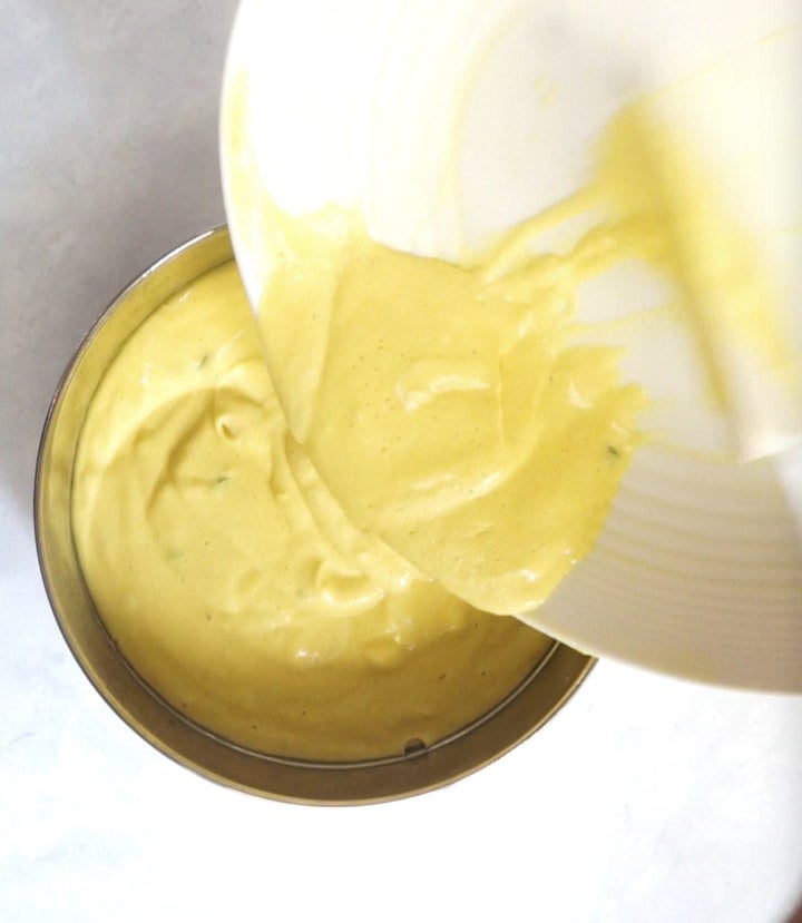 Khaman instant pot steps - Piping Pot Curry-4 Yellow colored Batter being put into a steel container