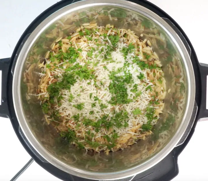 Parmesan and parsley over orzo pasta