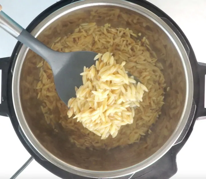 Orzo cooked in instant pot in a ladle