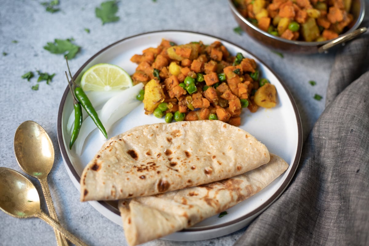 Aloo Gajar mater served in a plate with roti
